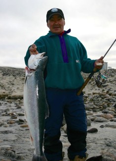 Sam Palituk, the other guide on this week-long outing, with a nice big arctic char from the river mouth. OK...the rod is for show as he and Jakco caught it, along with a few others, in the net they set out when we got to the cabin. They weren't biting on the lures at the time, but had I not had to do all this painting stuff, I am sure we would have tied into a few.