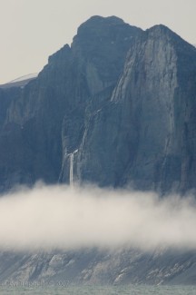 A waterfall pours out into the fog. I was hoping to get up close to this one because it looked very interesting the way it was situated on the side of the mountain. But high winds, and therefore rough waters kept me from getting any closer.