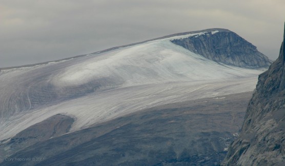 Distant ice cap covering the mountain top.
