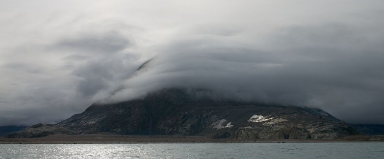 Layer-like clouds smothering the mountain at the bottom end of Walker's Arm.